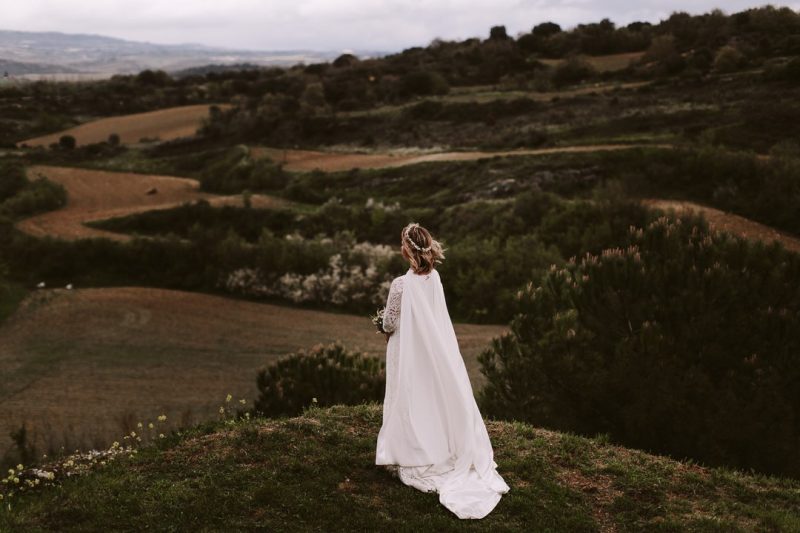 Alicia Rueda Bride with cape on mountaintop