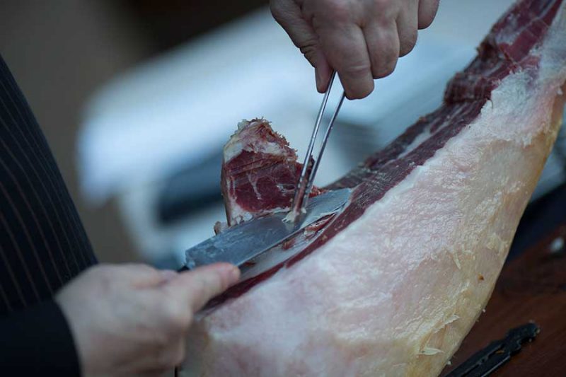 Leg of Spanish Ham being sliced